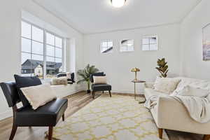 Office or formal living area with light LVP, open bay window, right off the front door