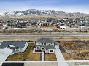 Aerial view of home with Oquirrh Mountain views in the back.