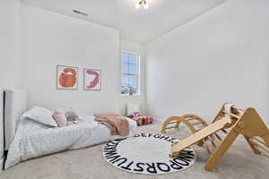 Bedroom with carpet floors and mountain views