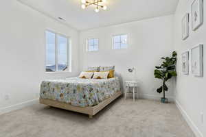 Bedroom with carpet flooring and double-door closet.