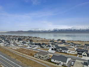 Birds eye view of property with views of Utah Lake and Wasatch Range.