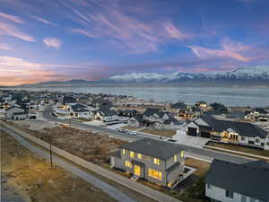 Aerial view at dusk featuring views of Utah Lake and Mount Timpanogos