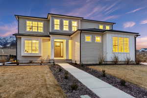 View of front of home featuring a lawn