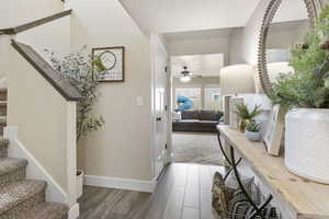 Foyer entrance featuring dark wood-type flooring