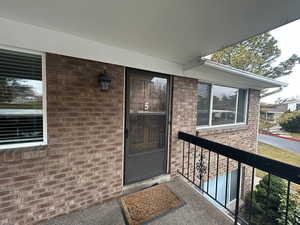 Property entrance featuring a balcony