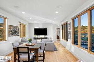 Dining space with light hardwood / wood-style floors