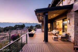 Deck at dusk featuring an outdoor hangout area