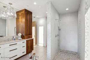 Bathroom with vanity and a shower