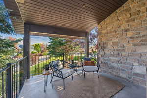 View of patio featuring a balcony