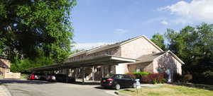 View of parking featuring a carport