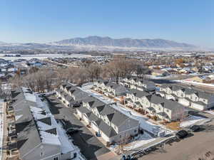 Snowy aerial view featuring a mountain view