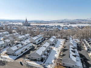 Snowy aerial view featuring a mountain view