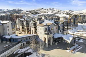 Snowy aerial view featuring a mountain view