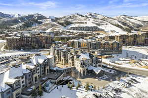 Snowy aerial view featuring a mountain view