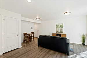 Living room with wood-type flooring