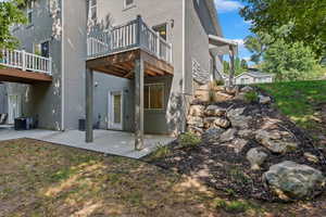 Back of property featuring central AC and a patio area