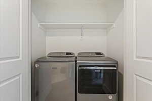 Clothes washing area with washing machine and clothes dryer