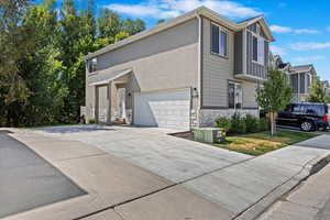 View of side of home featuring a garage