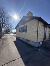 View of side of property featuring central air condition unit