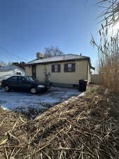 View of front of property featuring central air condition unit