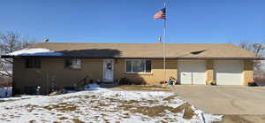 Single story home with a garage