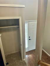 View of convenient coat closet and front door