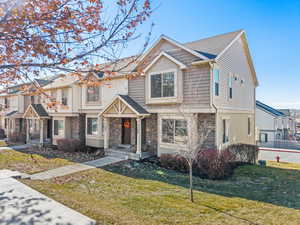 View of front of property with a front yard