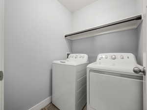 Clothes washing area featuring independent washer and dryer