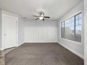 Empty room featuring ceiling fan