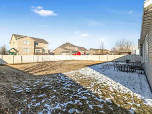 View of yard layered in snow