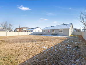 Rear view of house featuring a patio