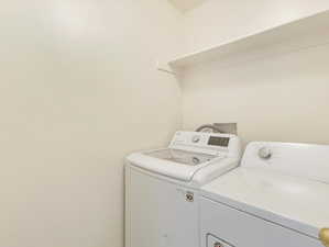 Laundry area featuring independent washer and dryer