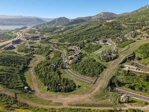 Aerial view of property and surrounding area with mountains