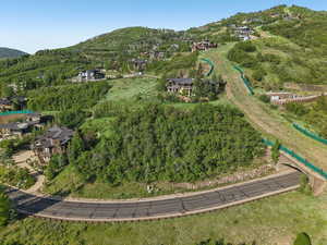 Aerial overview of property's location featuring a mountain backdrop