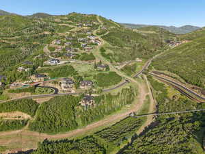 Aerial overview of property's location with a mountainous background