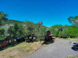 View of yard with a storage shed