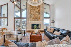 Gorgeous living room with fireplace and floor-to-ceiling windows