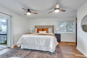 Master bedroom has beautiful hardwood floors