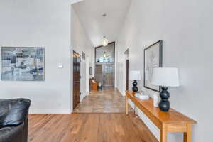 Entry with vaulted ceiling and hardwood floors