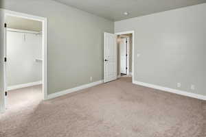 Unfurnished bedroom featuring a spacious closet