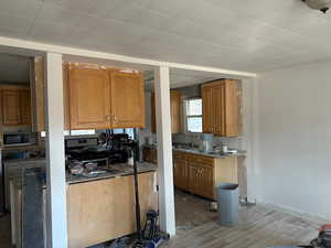 Kitchen with sink and hardwood / wood-style floors