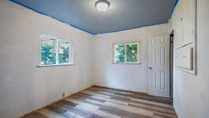 Unfurnished room with light hardwood / wood-style flooring