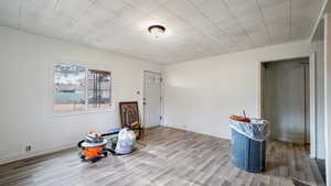 Miscellaneous room with light hardwood / wood-style flooring