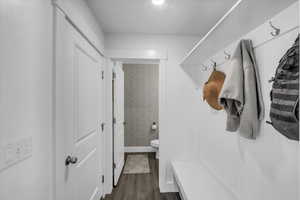 Mudroom with dark hardwood / wood-style flooring