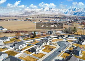 Birds eye view of property with a mountain view