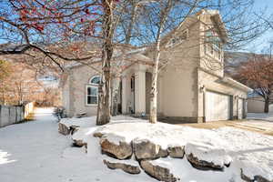 View of front of property with a garage