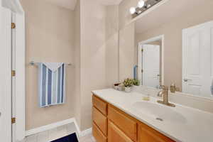 Bathroom featuring vanity and tile patterned flooring