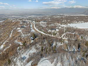 Snowy aerial view featuring a mountain view