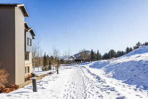 View of yard covered in snow