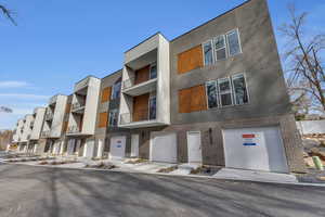 View of building exterior with a garage